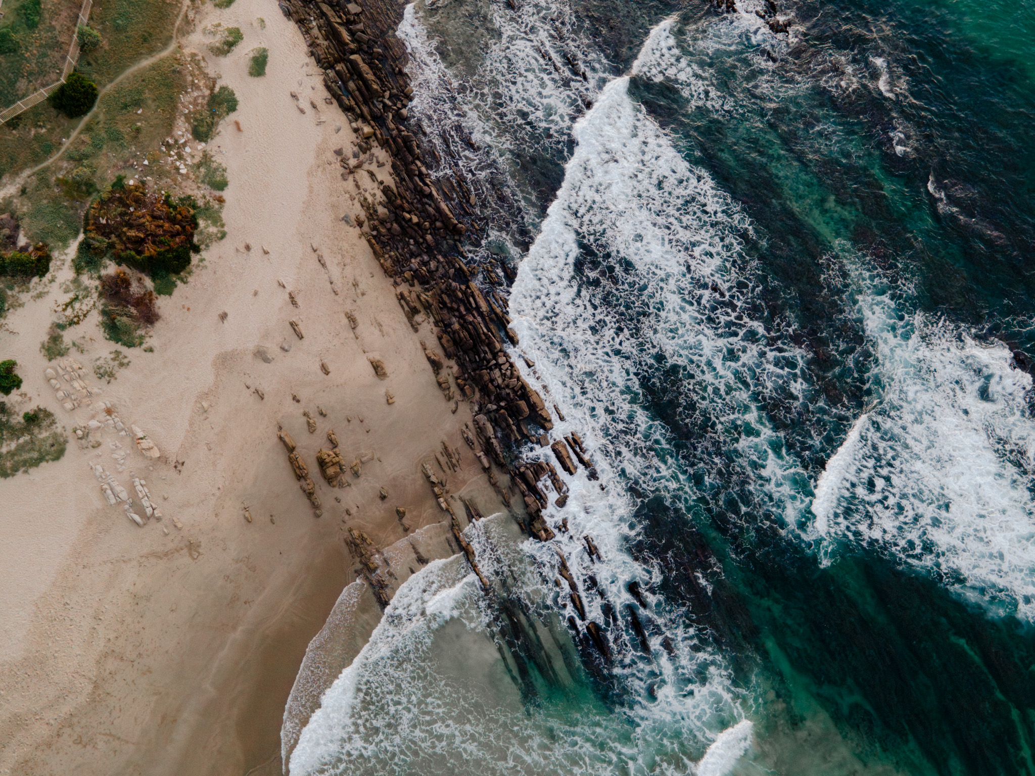 Aerial view of coastline near guesthouse